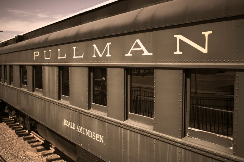 an old, black train sitting at the platform