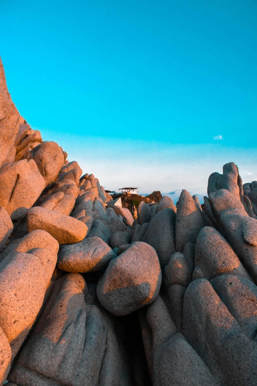 rocks that are covered in sand and water