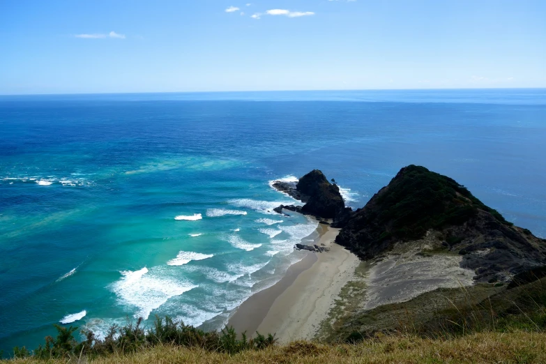 the view from top of an overlook looking out to sea