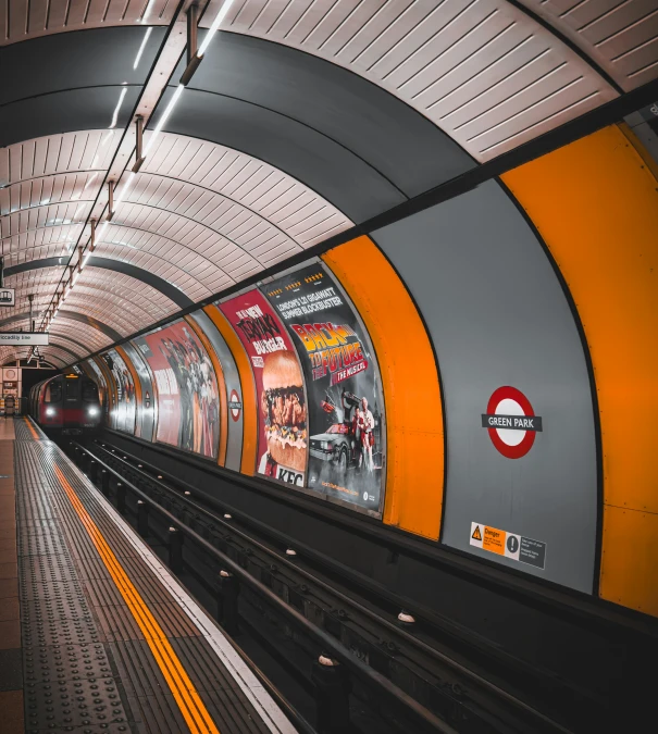 an empty train station with one of the platforms and an empty subway