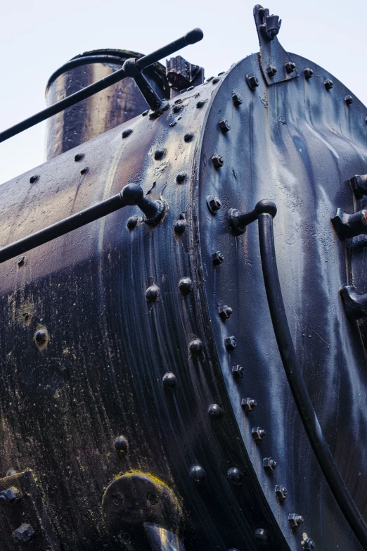 the side of an old, rusty steam locomotive