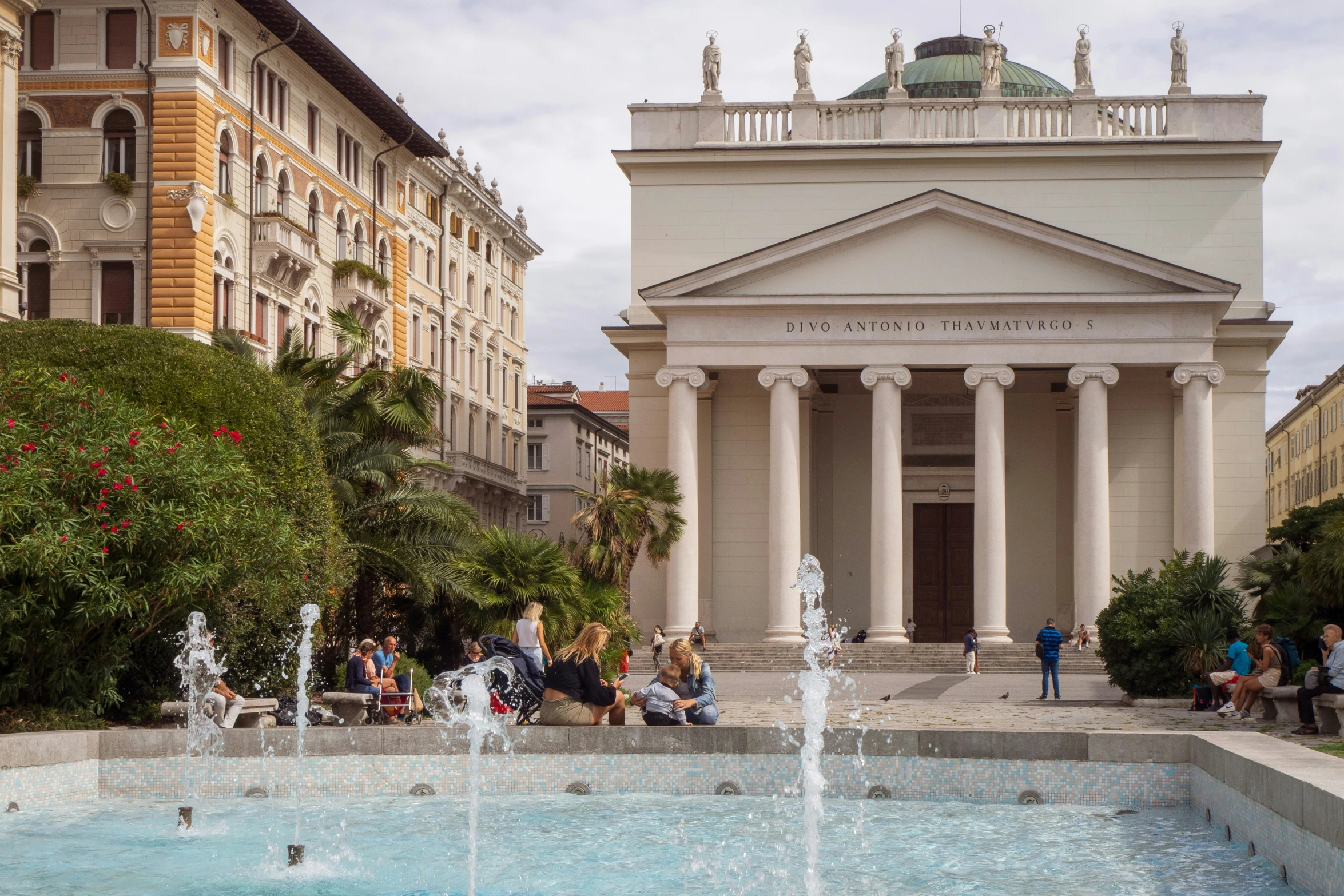 a group of people gathered around a fountain