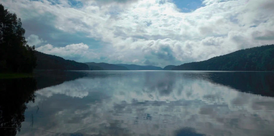 an image of a beautiful lake setting on cloudy day
