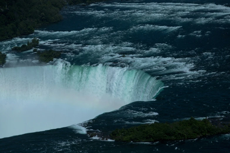 this is the view from a boat looking at a waterfall