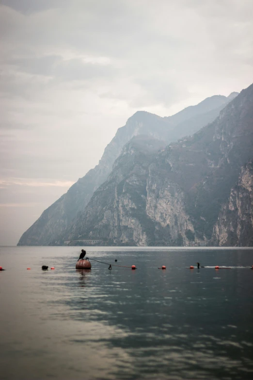 a man riding in a boat on a lake