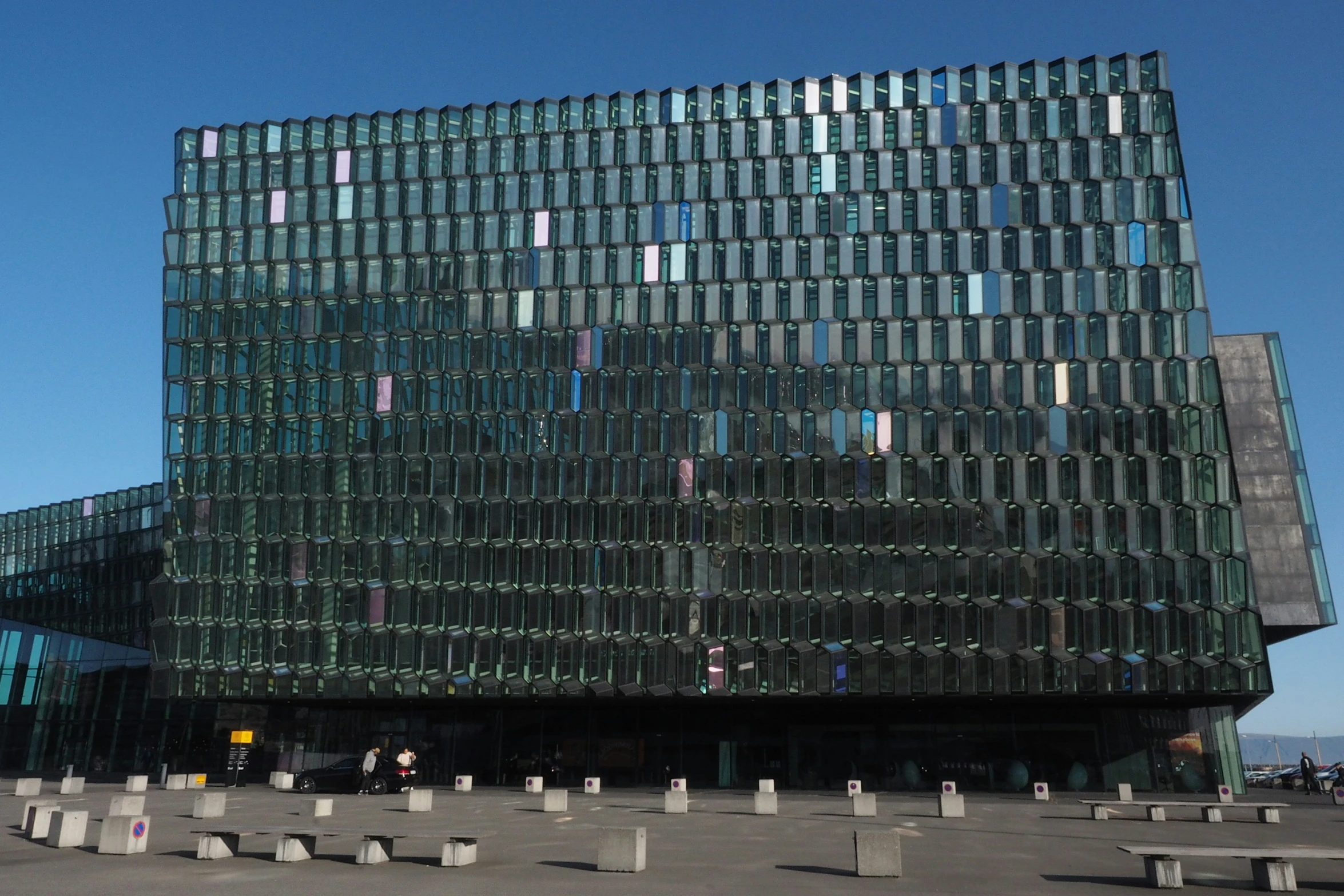 a very tall building with a very big glass structure