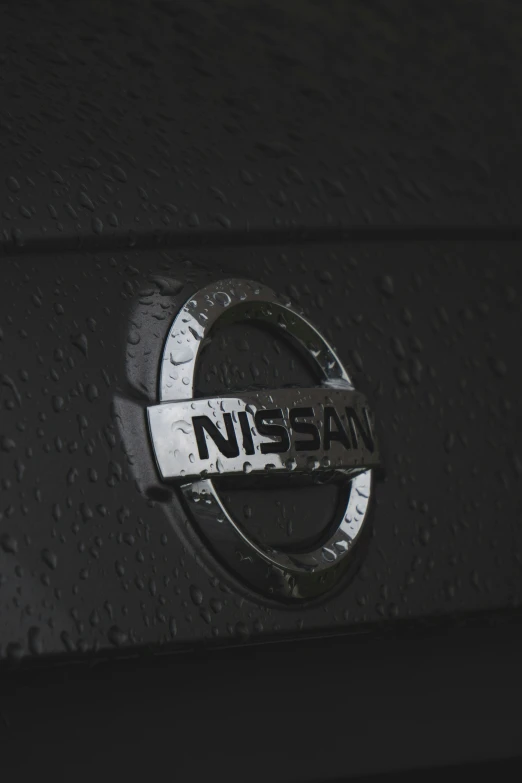the logo of a nissan on the hood of a car