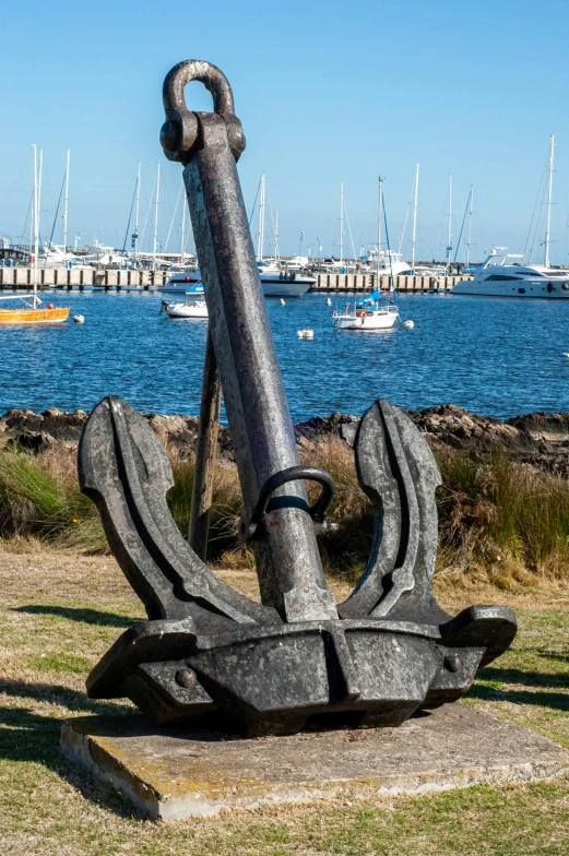 a very large anchor with a massive long handle