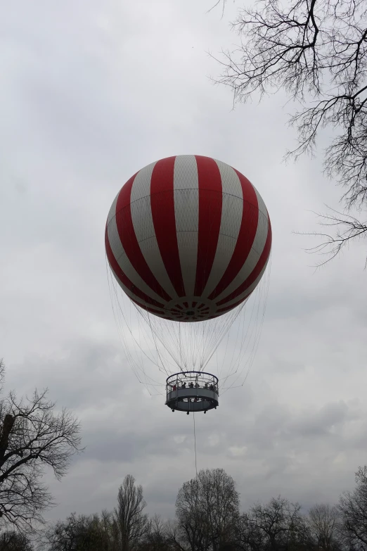 a  air balloon flying high up in the sky