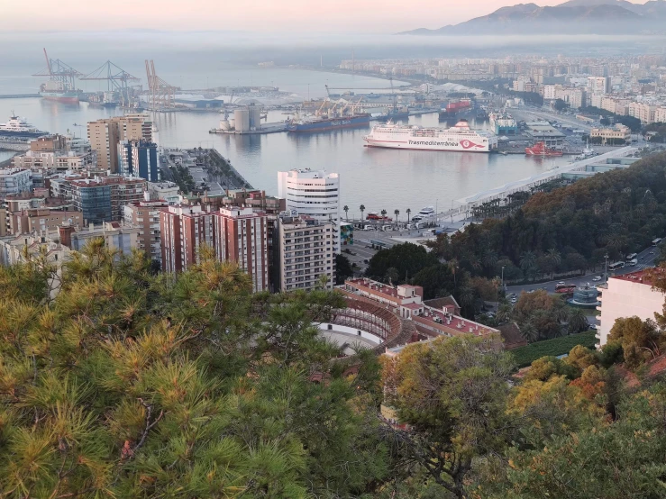 there is a city with mountains in the background