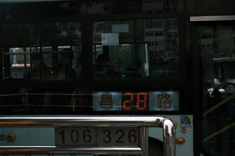 a large clock displays the time inside of a bus