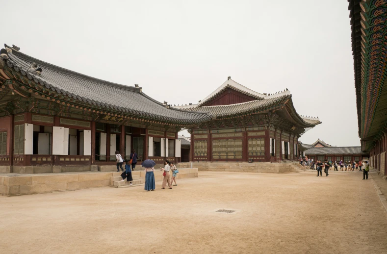 a group of people standing in a courtyard