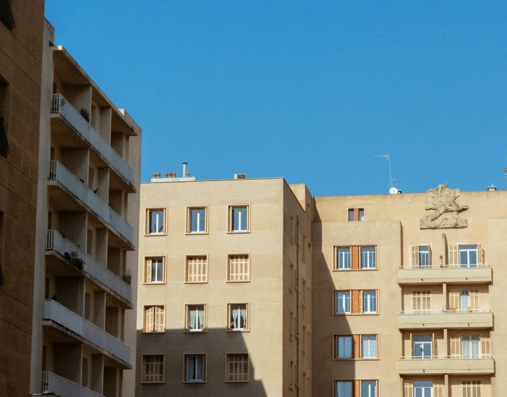 the building's windows are lined with balconies