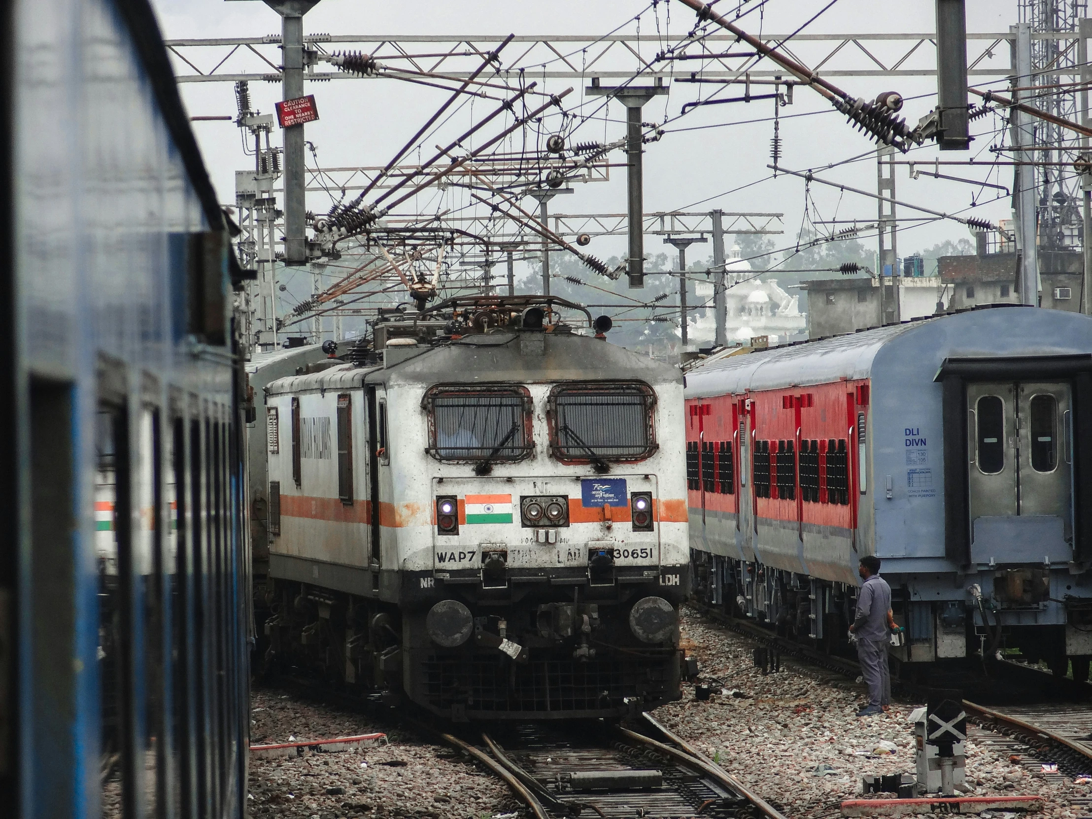 two trains next to each other on the tracks