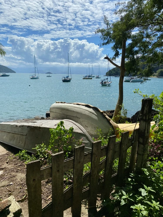 there are boats on the lake and on the beach