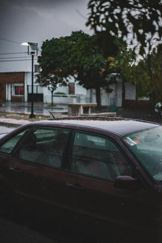 the car is parked in the street and on the curb