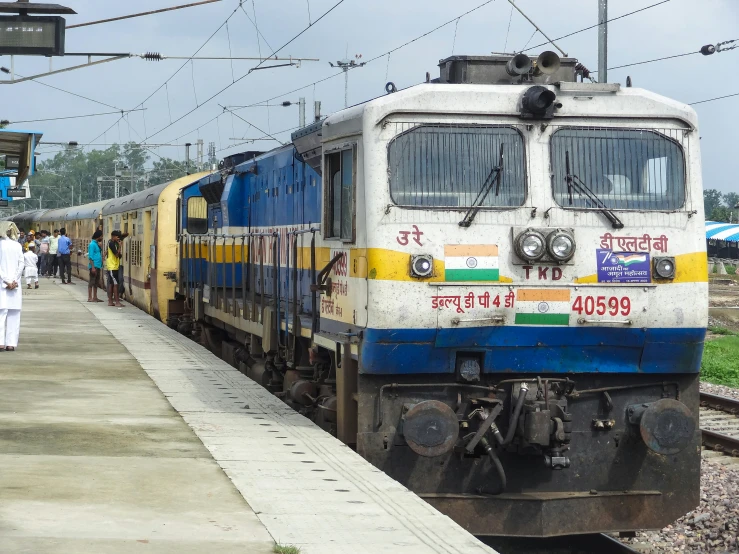 a passenger train on the track next to the platform