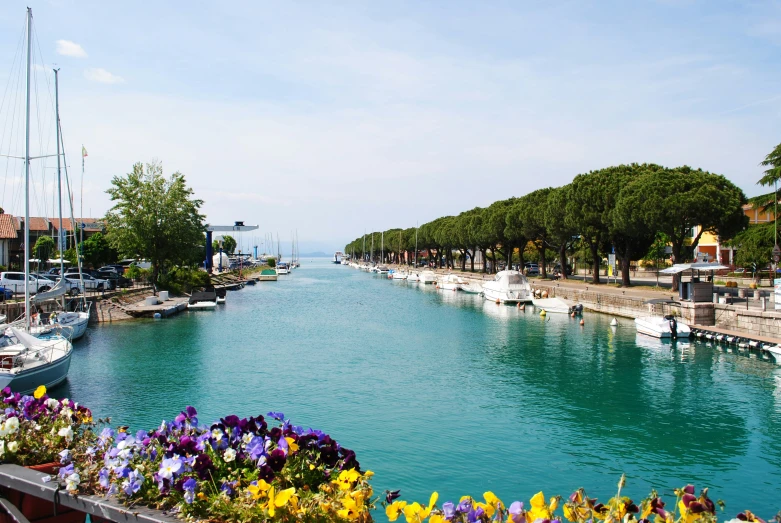 a river with several boats parked on top of it