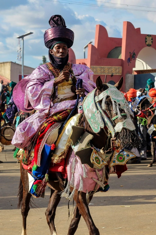 a woman riding on the back of a donkey