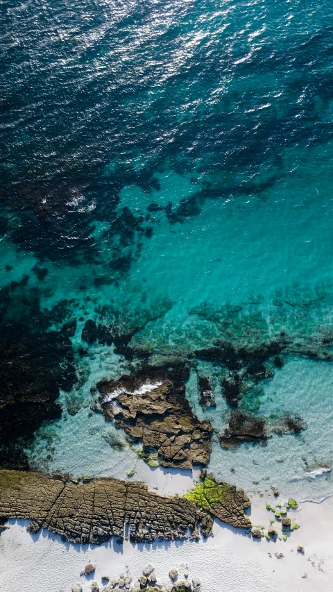 this aerial view shows the water and the rocks from above