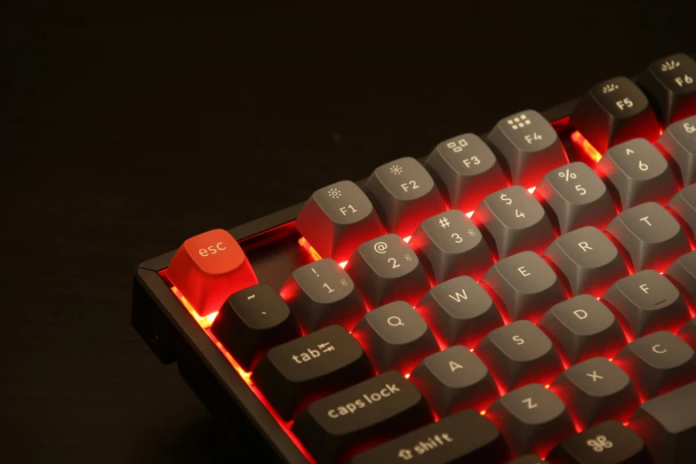 a black and red keyboard that is on a table