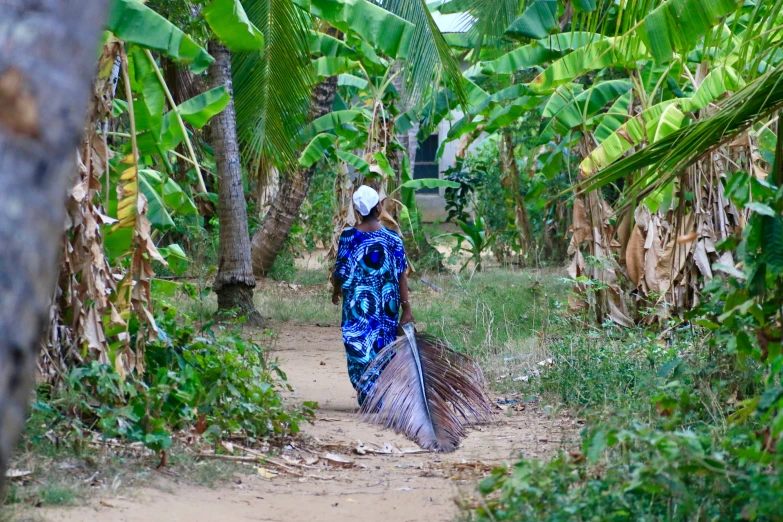 a woman with a blue outfit and a long hair