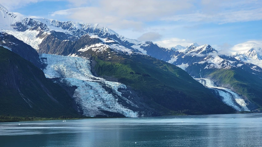 a view of some mountains from a body of water