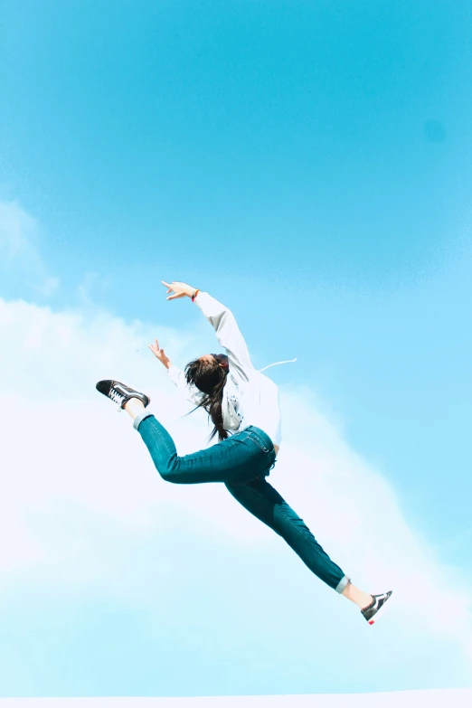 the woman is flying with her kite high in the sky