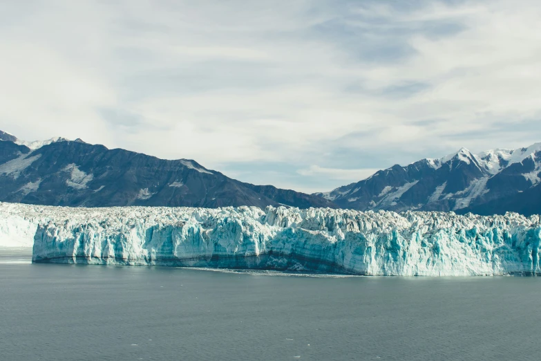 large mountain ranges in the background with large glacier