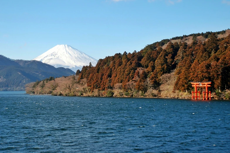 a mountain range and a lake are seen