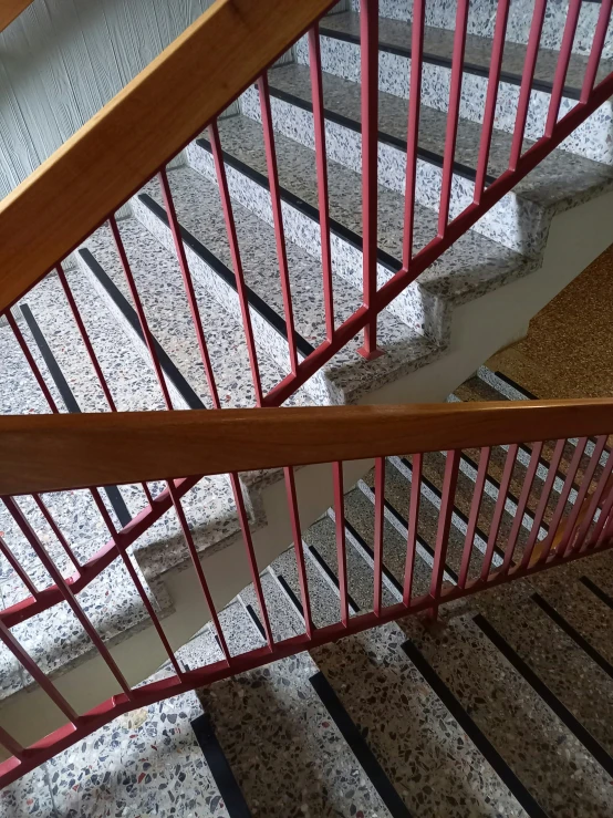 the stairs inside the building are pink and white