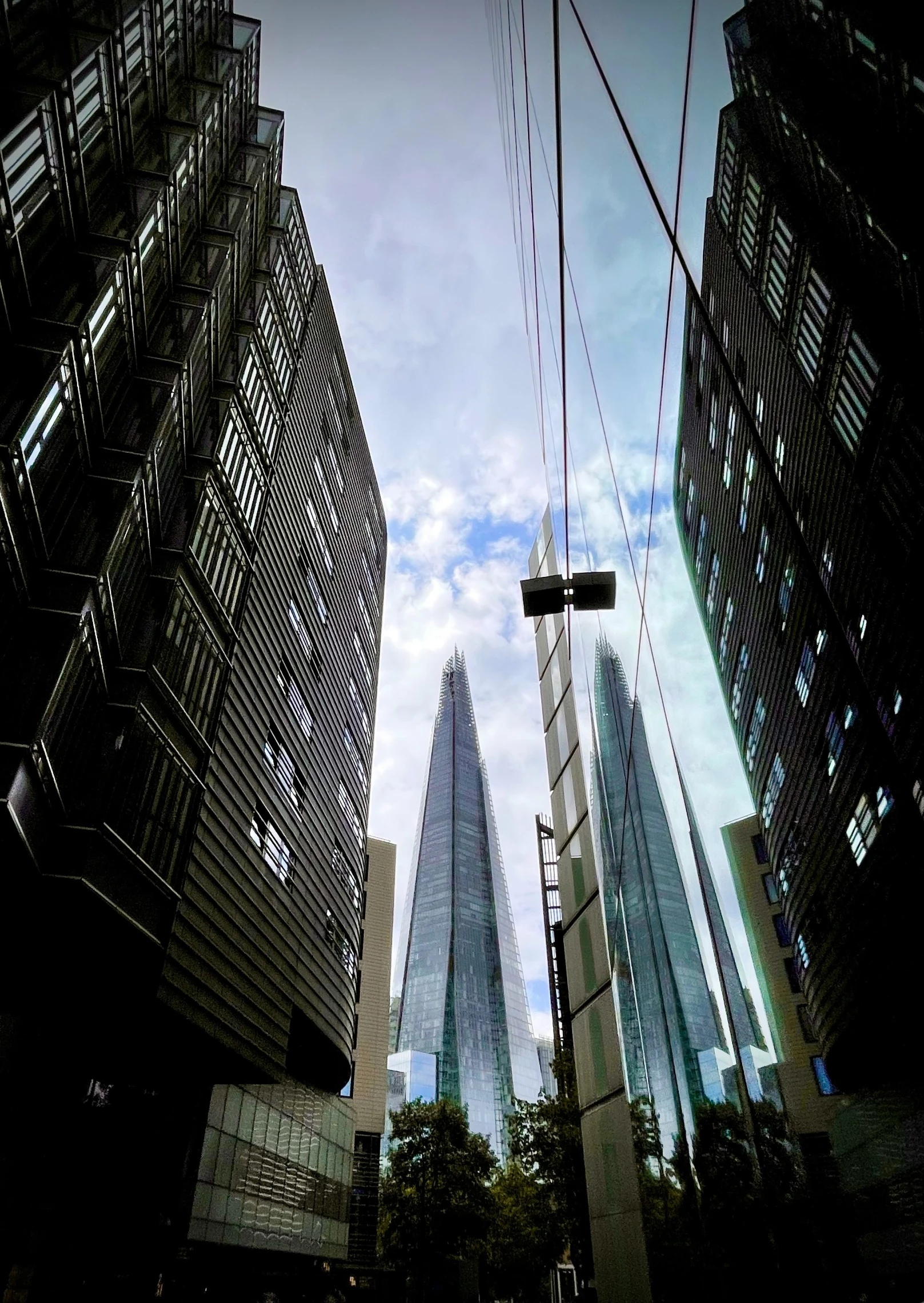 looking up at a group of tall skyscrs in the city