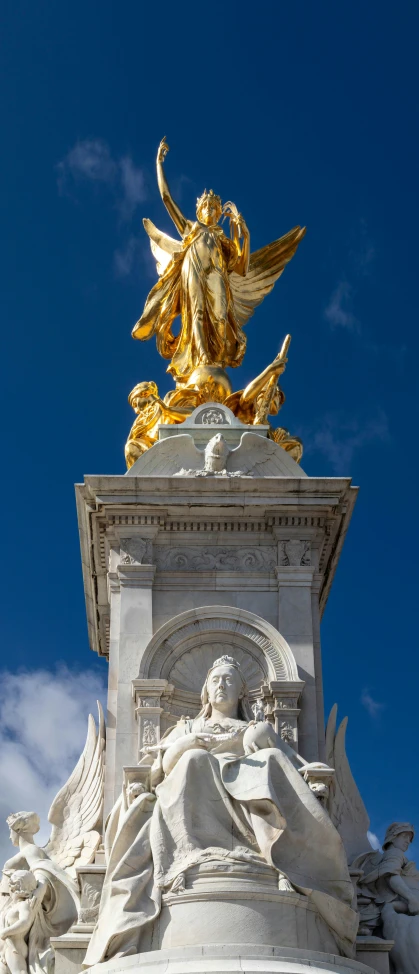 an image of the golden angel statue on top of building