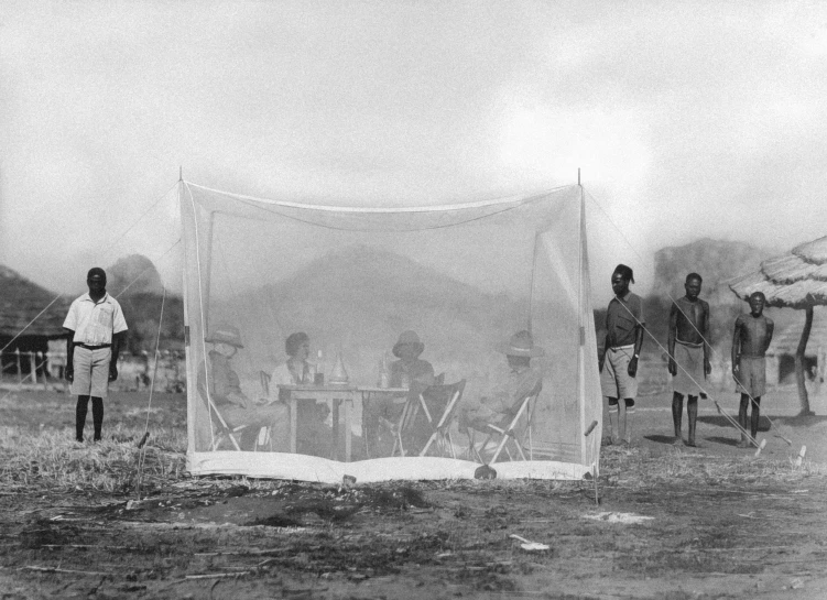 men run past a canvas covered in water