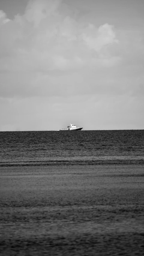 a boat is out in the open ocean on a sunny day