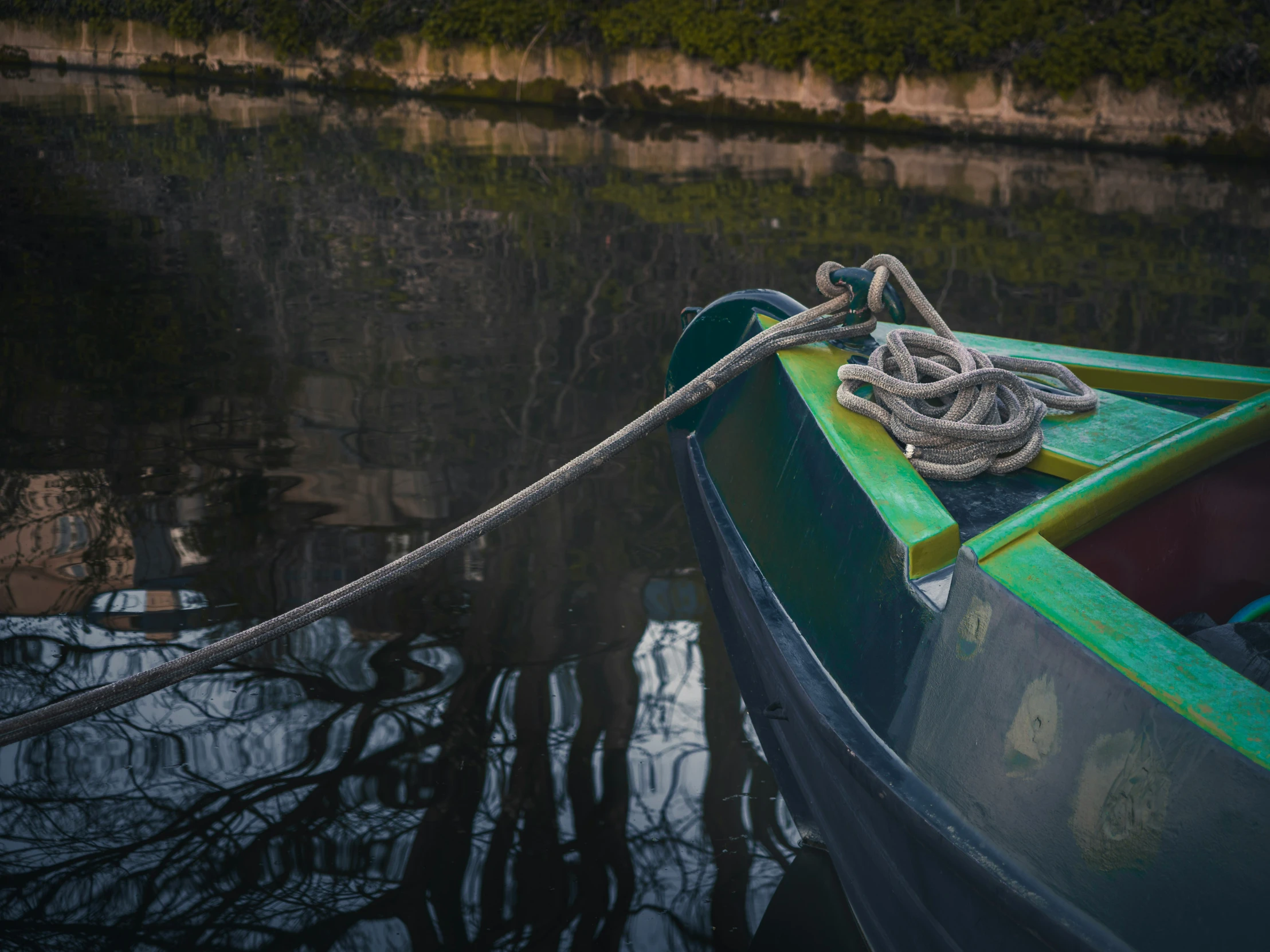 a small boat that is docked in some water