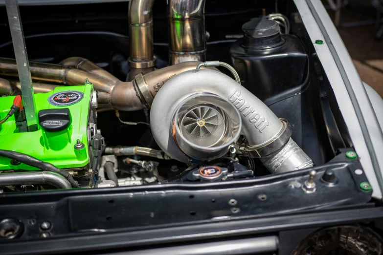 a green turbo into the hood of a truck