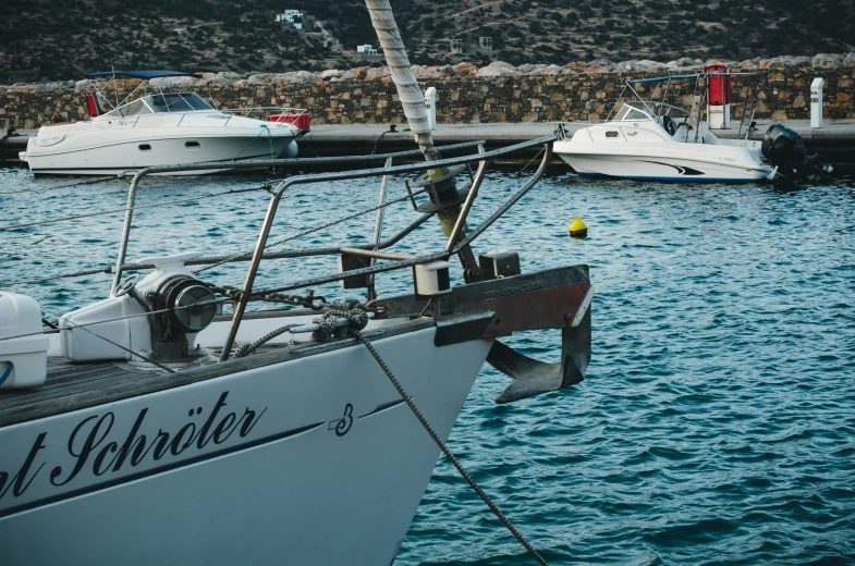 a boat parked at the dock with a number of boats