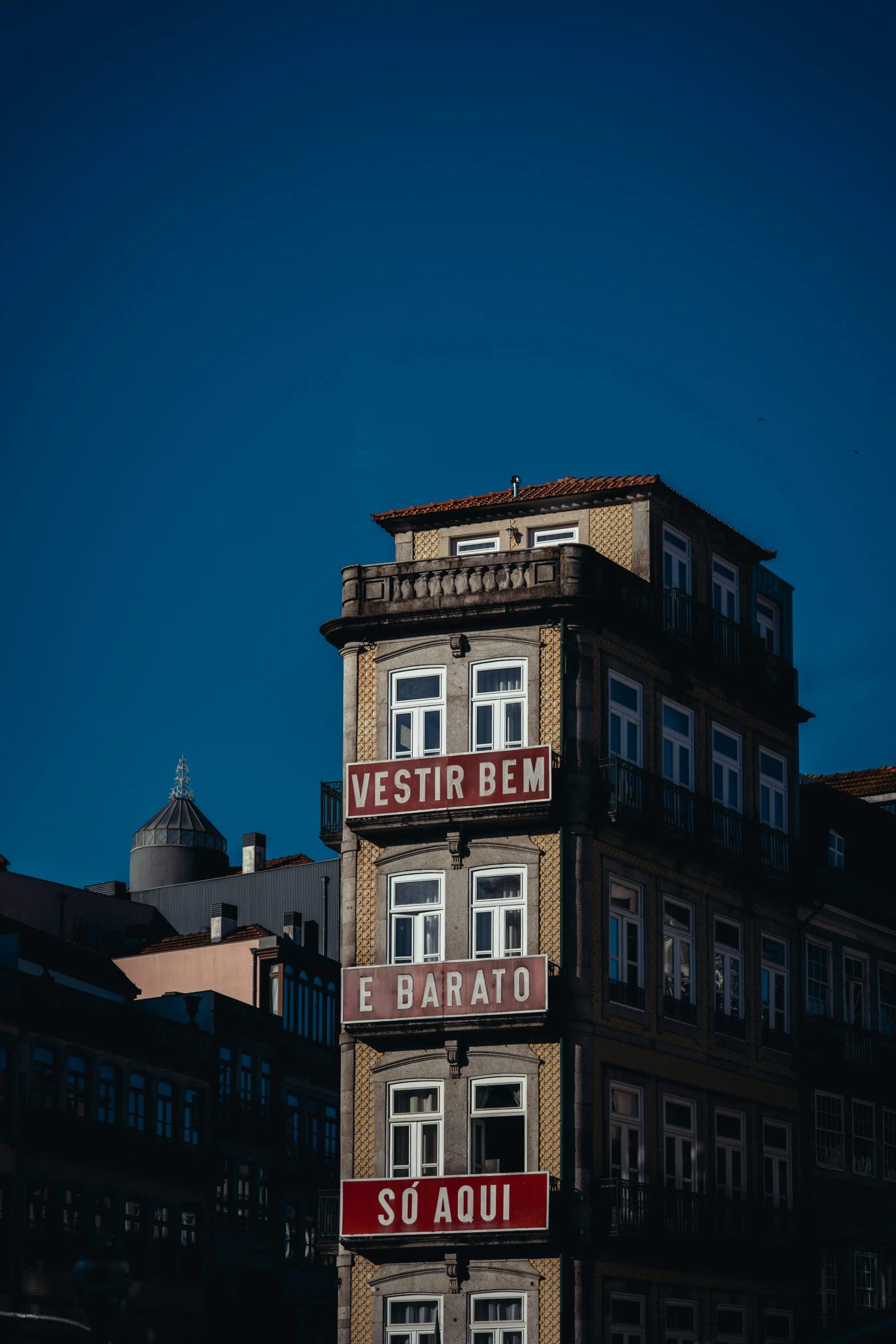 a large building with multiple windows on a clear day