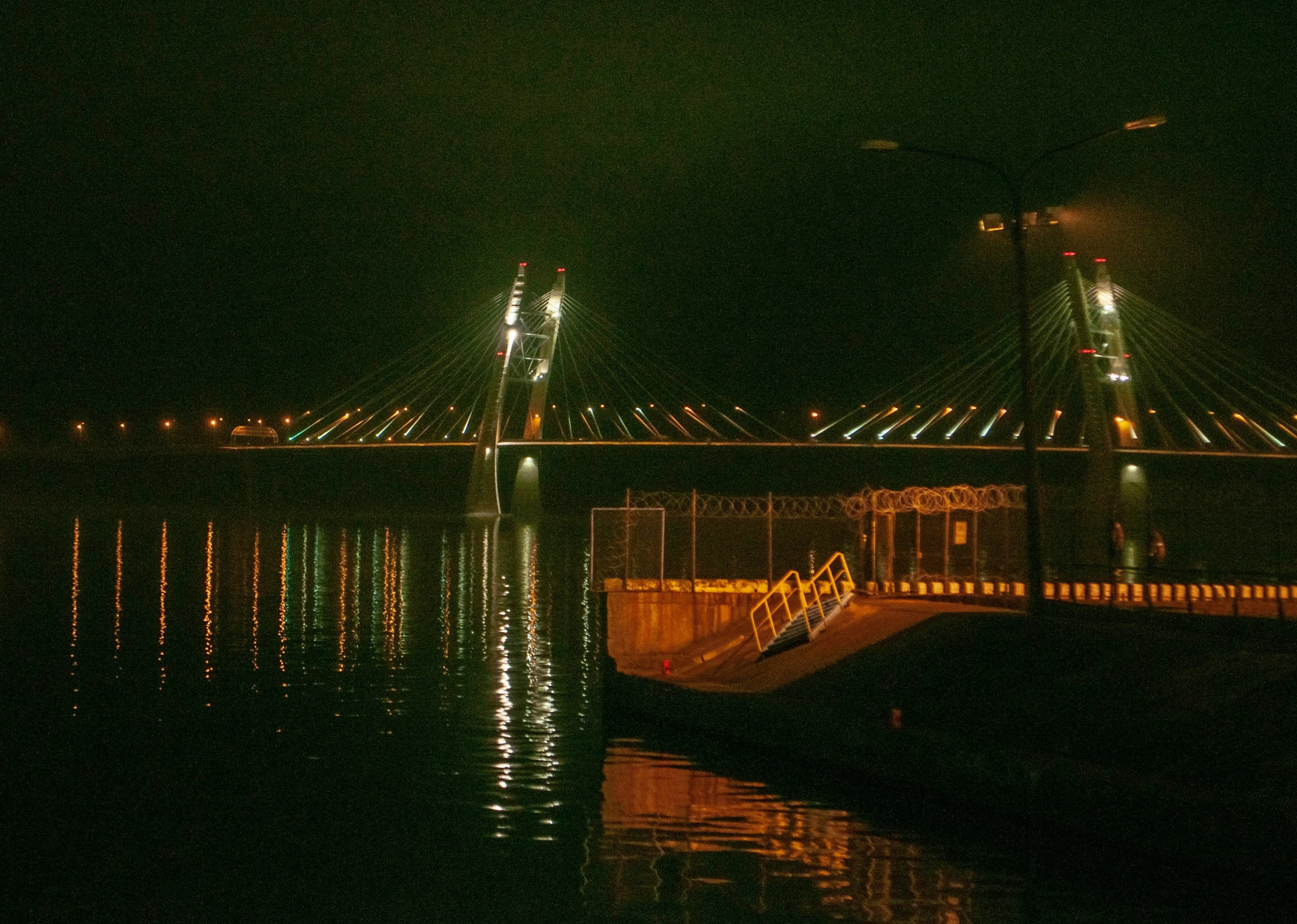 a long exposure po of a bridge at night