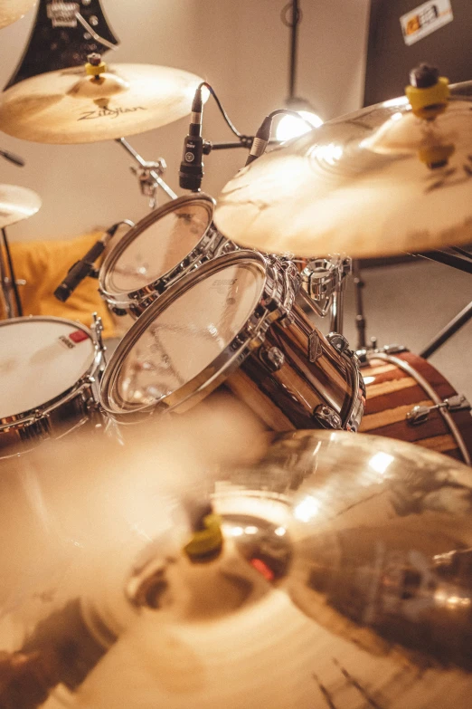 a pair of drums and some sticks on the floor