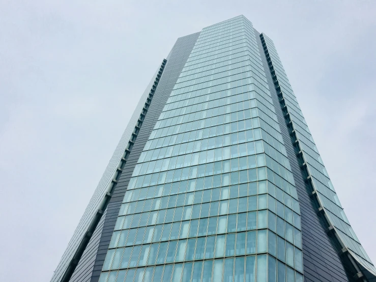 the side of an office building, in front of the sky