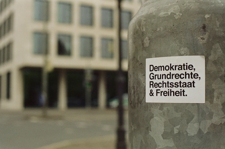 a sticker posted to a large gray object