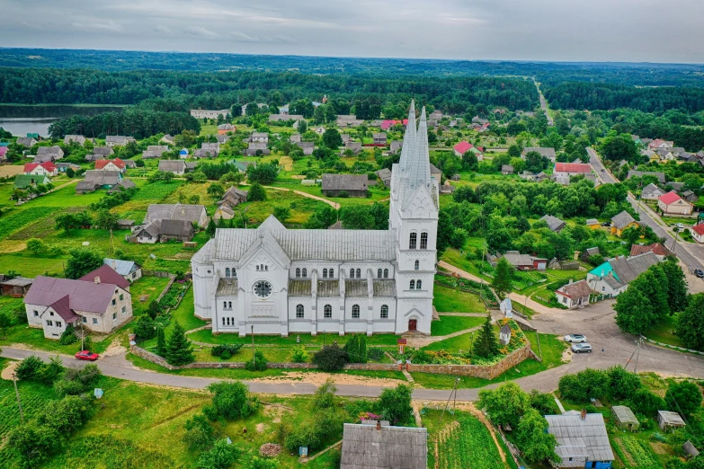 an aerial view of a large white church