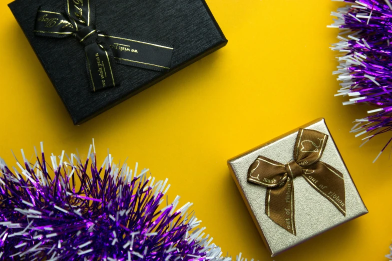 christmas presents are displayed on an ornate yellow background