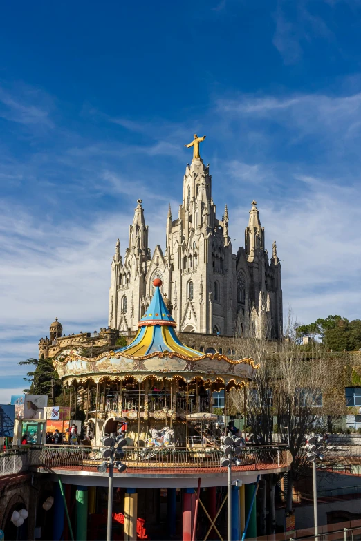 there is a carousel next to the cathedral