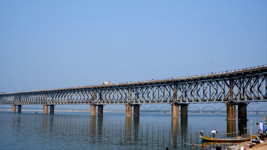 a large long bridge crossing over a large body of water