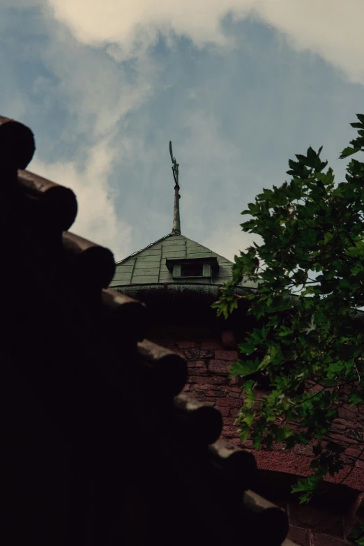 a tall building with a steeple and a cross on top