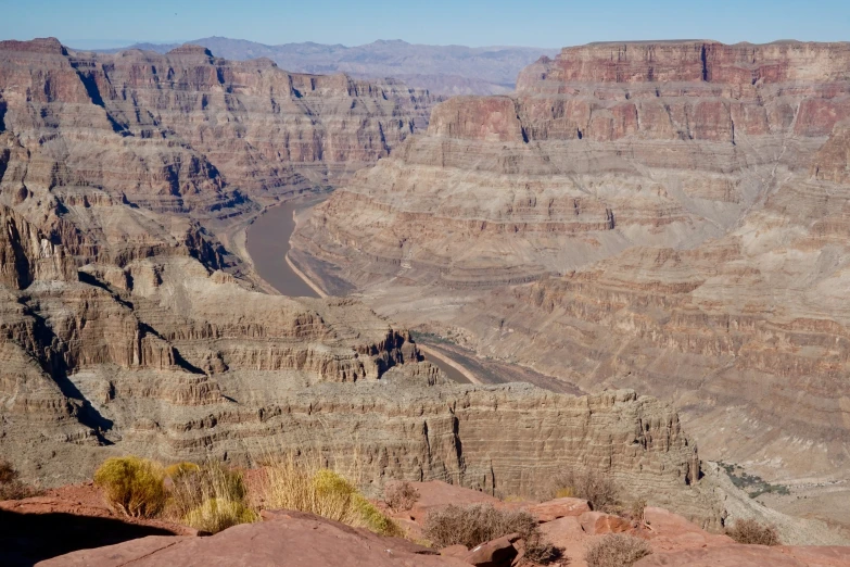 a vast expanse of rocky mountains near an ocean