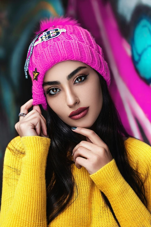 a woman wearing a bright pink knit hat